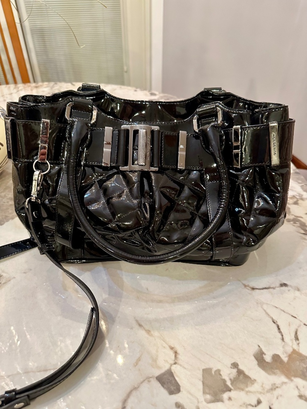 Burberry black patent leather handbag with silver hardware and crossbody strap #
